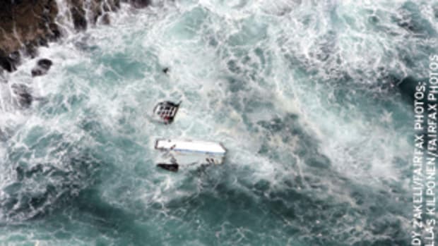 Pieces of the 80-foot maxi-yacht PricewaterhouseCoopers were strewn along the rocky coast of Flinders Islet off Southeast Australia. Skipper Andrew Short and navigator Sally Gordon died in the nighttime grounding.
