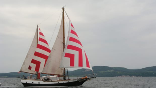 Irving Johnson’s famous ketch Yankee flies every stitch of canvas reaching across Bras d’Or Lake in Nova Scotia. Photo by Gordon van Nes.