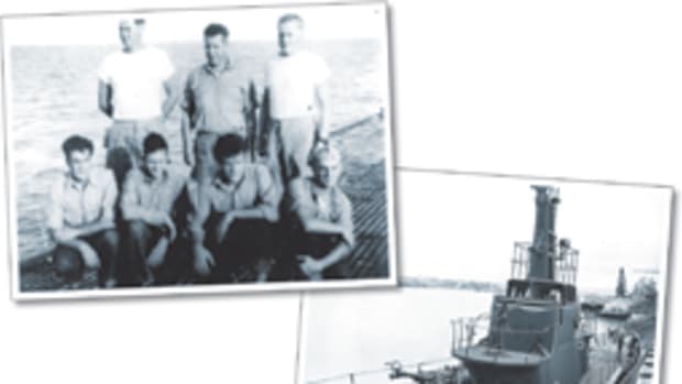 Seven of the eight survivors of the Flier (right) on the deck of the submarine Redfin soon after their rescue. One crewman was absent due to an illness.