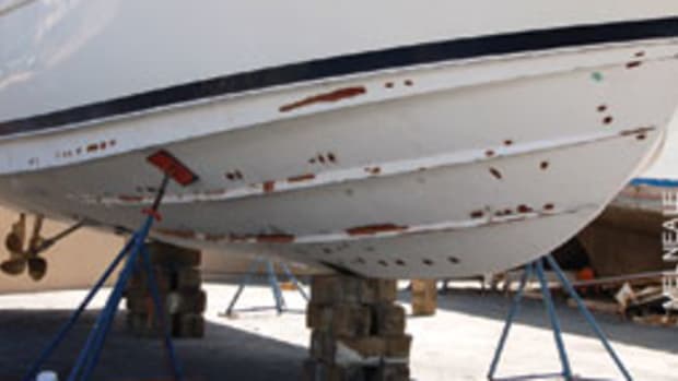 The hull of a newer boat showing voids, blisters and weak spots being repaired.