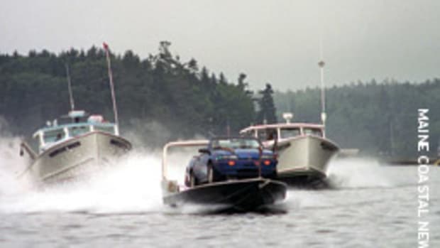 Maine boatyard owner Steve Johnson succeeded in his attempt to draw attention to the annual Maine lobster boat races with his Ca'-Boat.