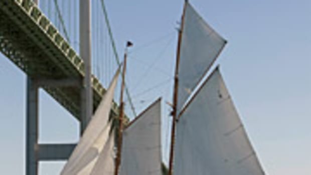 The schooner Eleonora sails under the Newport Bridge at the Best Life Classic Yacht Regatta held in late August. Venerable designer and sailor Ted Hood helmed his newly restored yacht Robin to the top of the fleet.