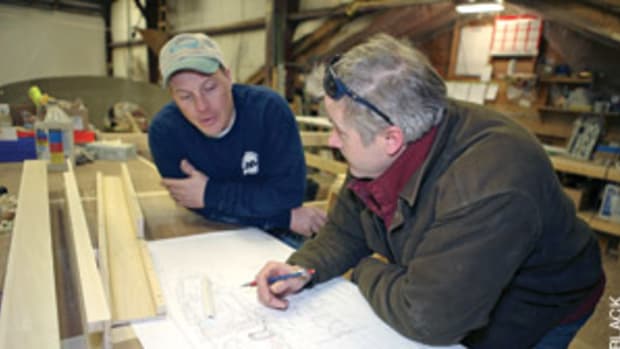 Keith Herridge (left), lead mechanic at custom builder Lyman-Morse, discusses a design with project manager Michael Faller.