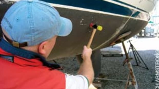 A surveyor will tap the hull with a small hammer to check for delamination.