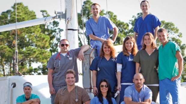 Dr. Benjamin LaBrot (kneeling, second from left) and a volunteer crew of profesisonals are sailing to areas where people are in need of medical care. First stop: Haiti.