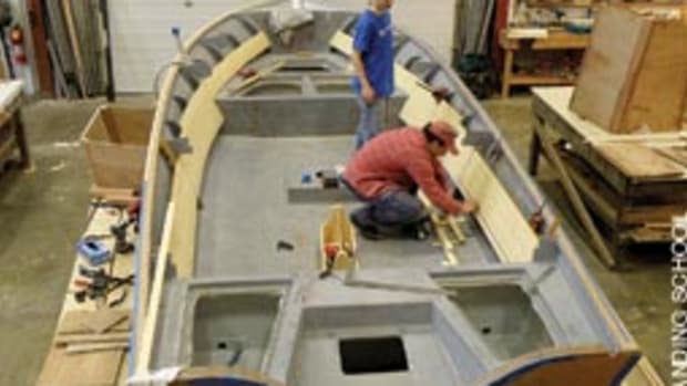 Students work on a cold-molded Fly Fisher 22 center console designed by Van Dam Custon Boats for saltwater flyfishing in the Northeast.