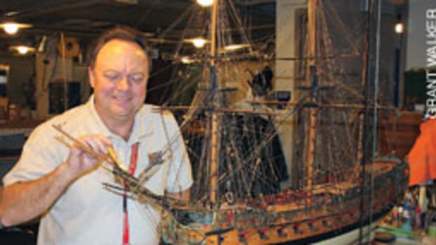Donald Preul, himself a builder of models, cares for the Naval Academy's model ship collection.