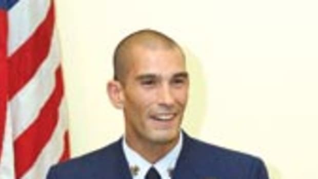 Coast Guard aviation survival technician Salvador 'Pepe' Carire receives his AFRAS gold medal.