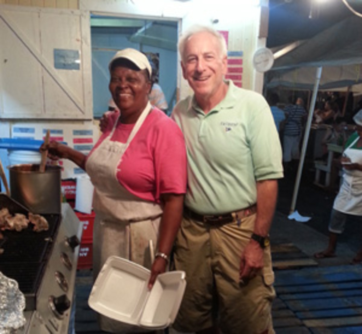 The author is all smiles with Gemma, the owner and head chef at his favorite Antigua restaurant.