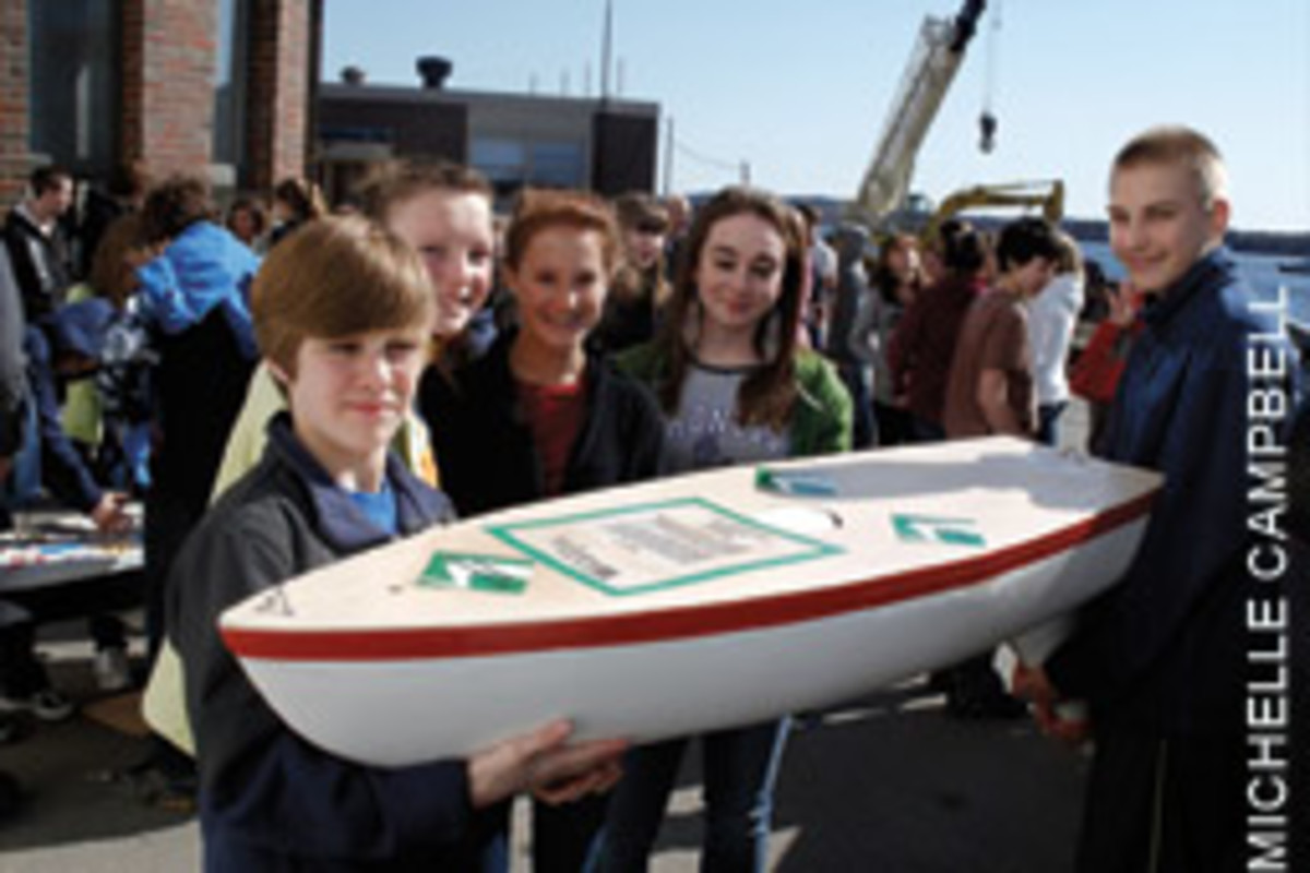 Students from Wagner Middle School in Winterport, Maine, with their mini-boat, Pridetanic, which landed in Portugal after seven months on the Atlantic