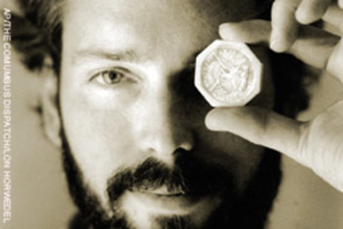 Thompson holds a $50 pioneer gold piece from the wreck of the Central America in this photo from 1989.