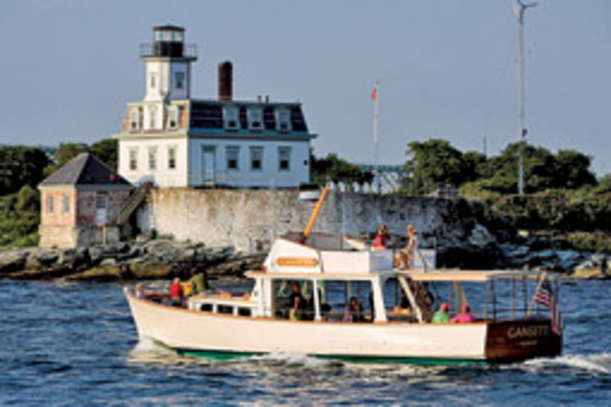 The restored wooden vessel Gansett cruises off Rose Island, R.I.