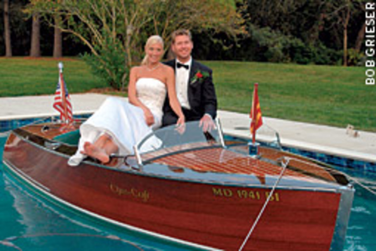An old wooden runabout neatly tied up in a swimming pool is not something you see every day, but it is when a young Maryland couple decided to create a memorable wedding day photo.