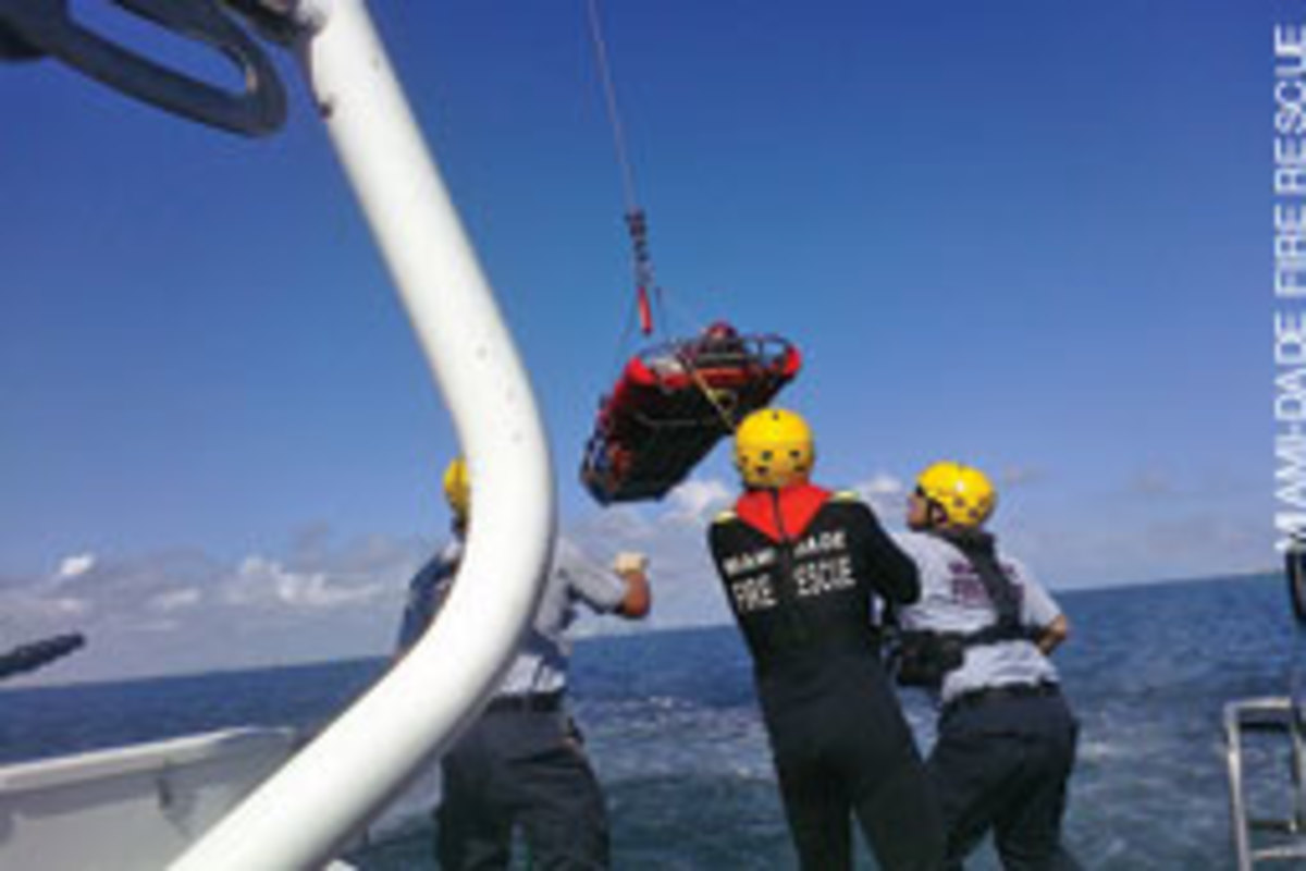 One of the victims is hoisted on board for medical treatment.