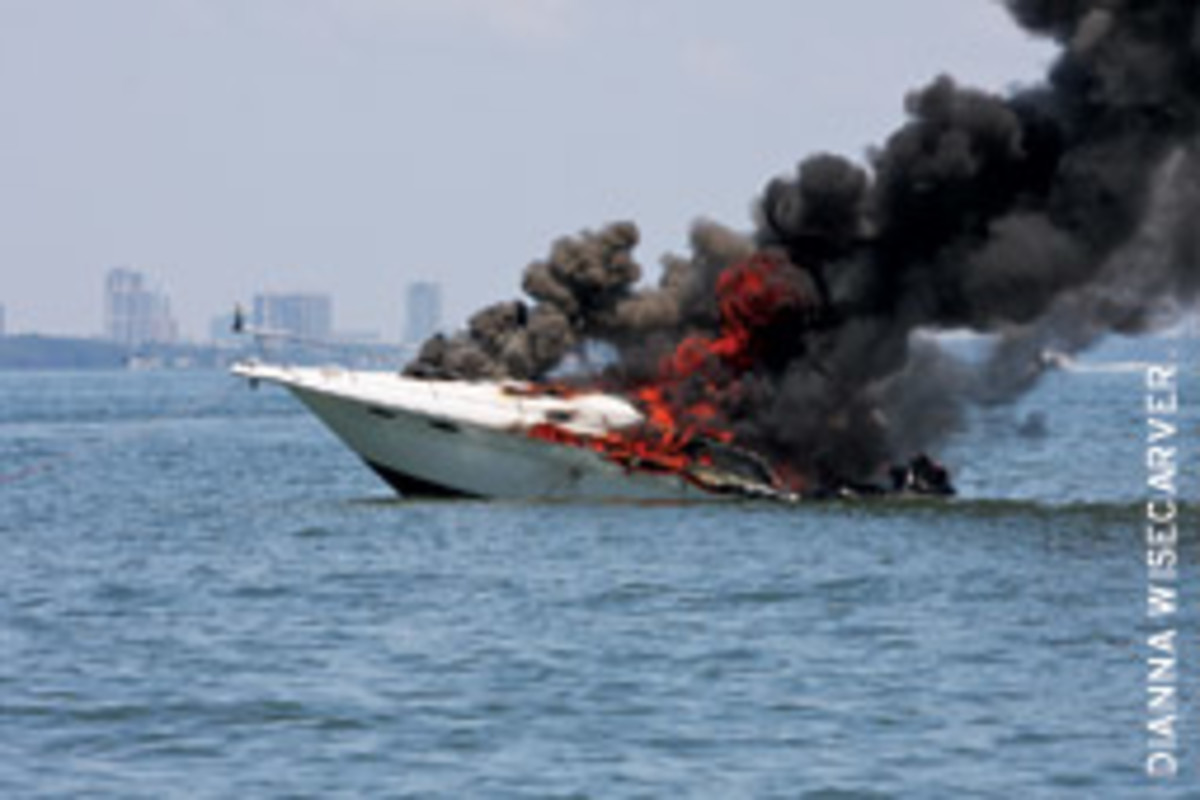 The 33-foot Sea Ray burned to the waterline following an explosion in the area of the stern.