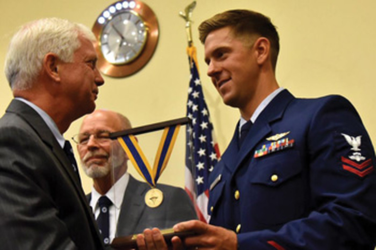 Coast Guard rescue swimmer Christopher Leon is a recent gold medal recipient for his heroic actions in rescuing four men from a rowing boat.