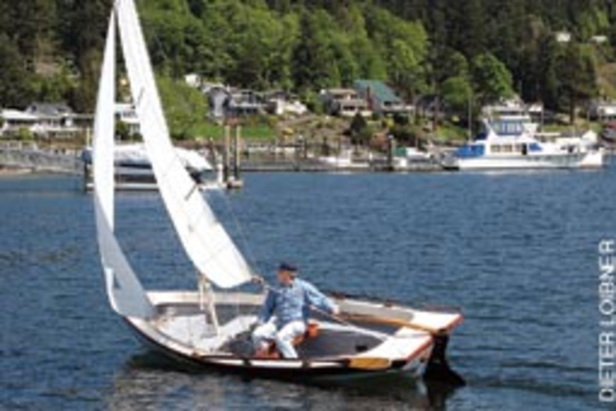 Dave Robertson reaching across the bay of Gig Harbor in his 17-foot Jersey Skiff.