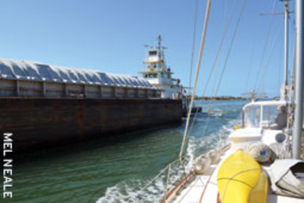 Passing a tug and barge in a narrow channel can test the skipper's skill.