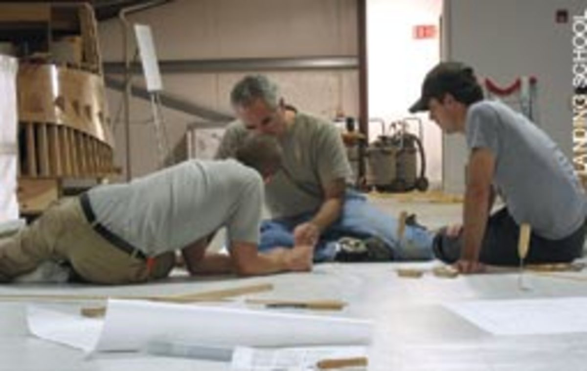 As part of the Wood Composite course, instructor Rick Barkhuff works with students to loft the Arundel 27.