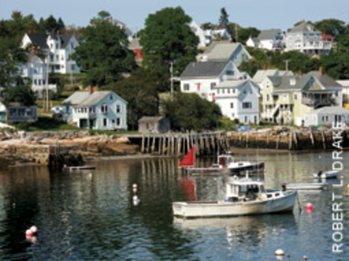 Lobster boats ride on their moorings.