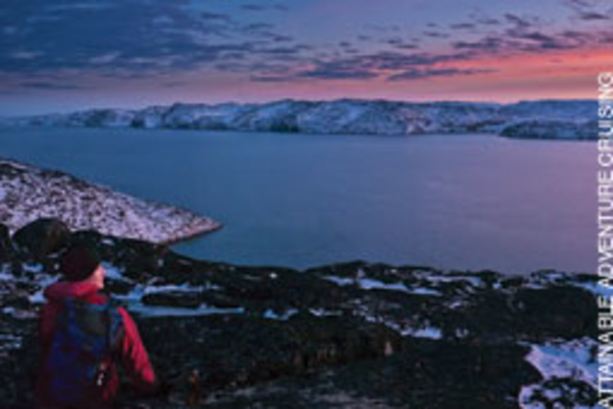 Phyllis Nickel admires the noon light from a hill in Greenland.