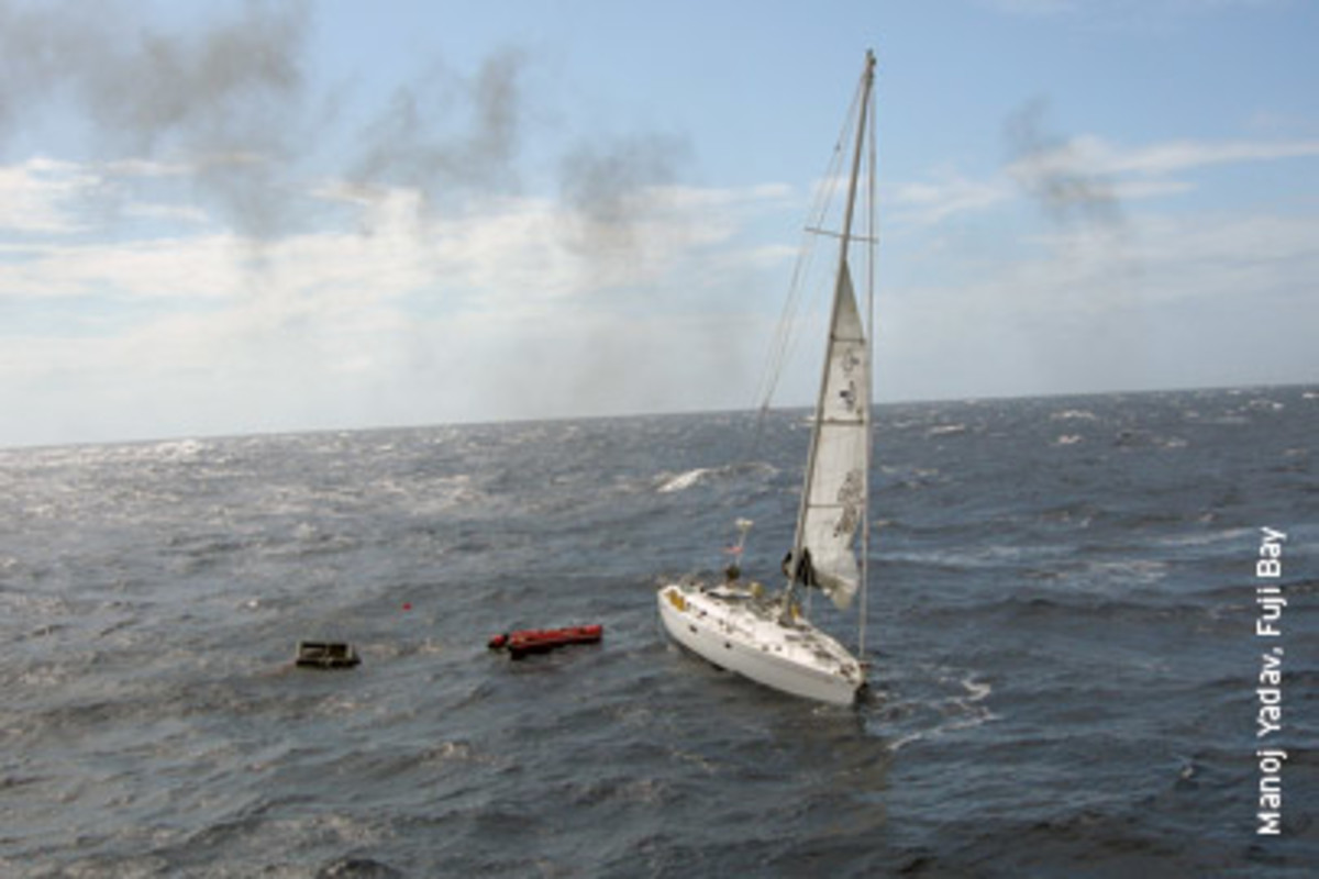 Blue Chip as she was last seen, about 105 nautical miles south of Kingston, Jamaica. The unusable life raft is pictured at left.