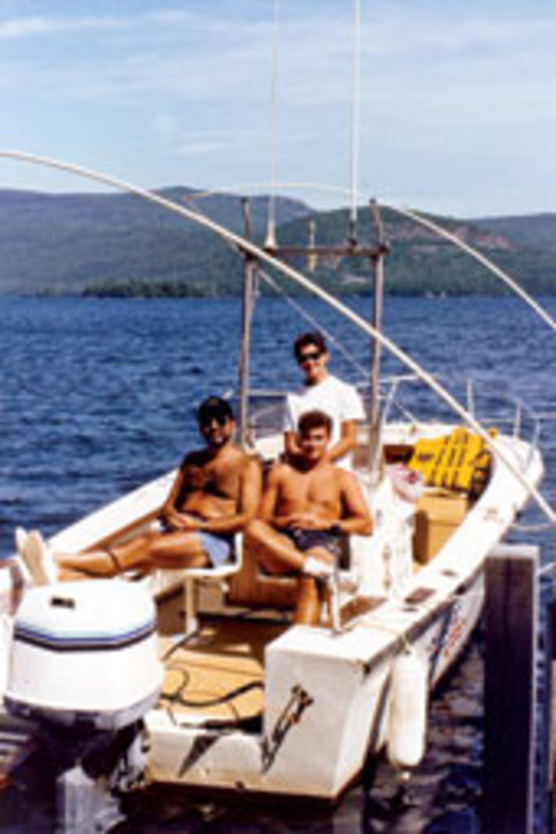 Abess and sons John (seated) and Alexander on Lake George, N.Y, in 1988.