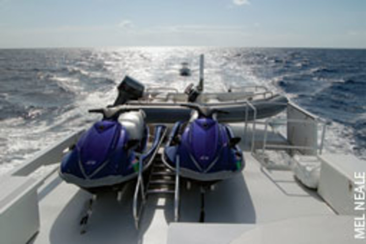 A mothership and her eager charges - a couple of PWCs, a RIB and a center console in tow.