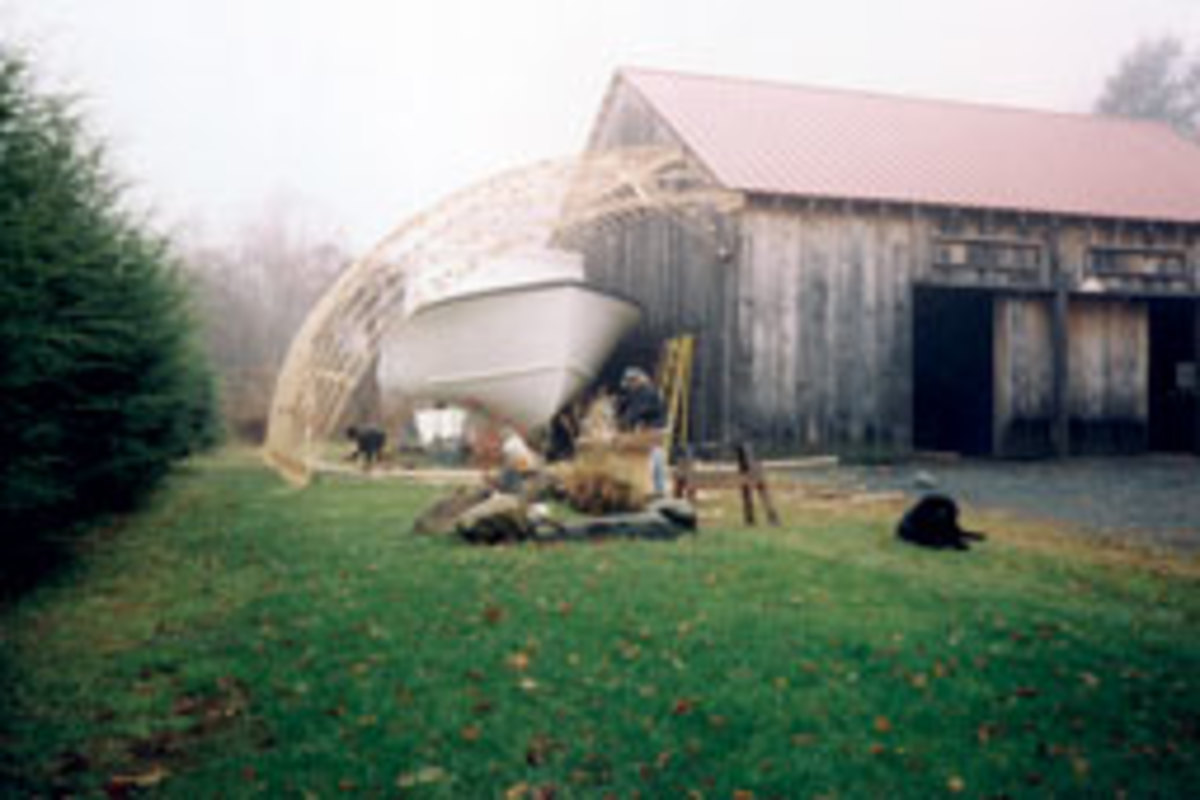 Dan Stubbings, 46, bought a Duffy 38 kit boat from Atlantic Boat Co. in Brooklin, Maine, and built a temporary canopy on his barn to fiinish it off.