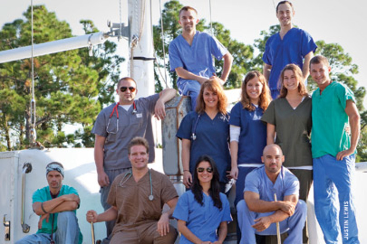 Dr. Benjamin LaBrot (kneeling, second from left) and a volunteer crew of profesisonals are sailing to areas where people are in need of medical care. First stop: Haiti.