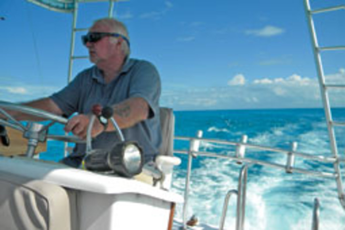 Barry Terry at the helm in blue Caribbean waters.