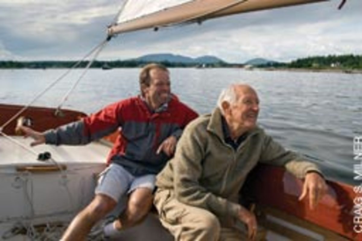 Beaulieu (left) and boat owner Rod Lucas sail the Pisces 21.