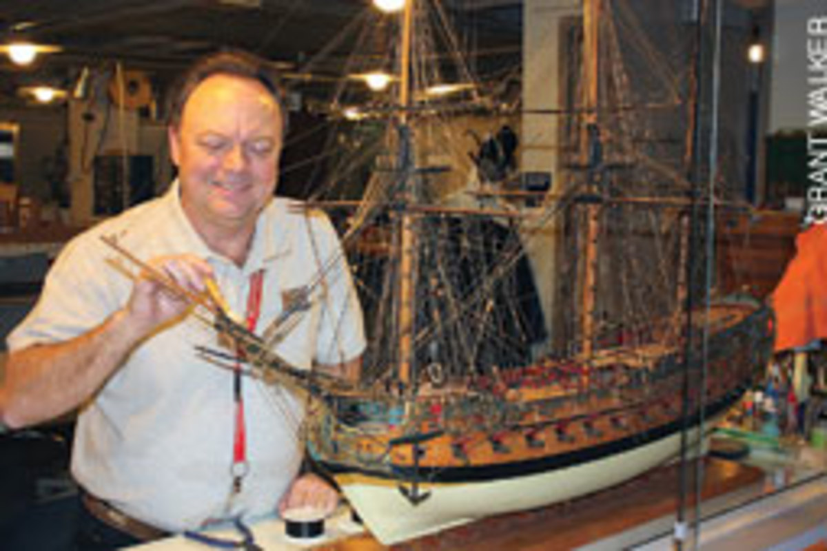 Donald Preul, himself a builder of models, cares for the Naval Academy's model ship collection.