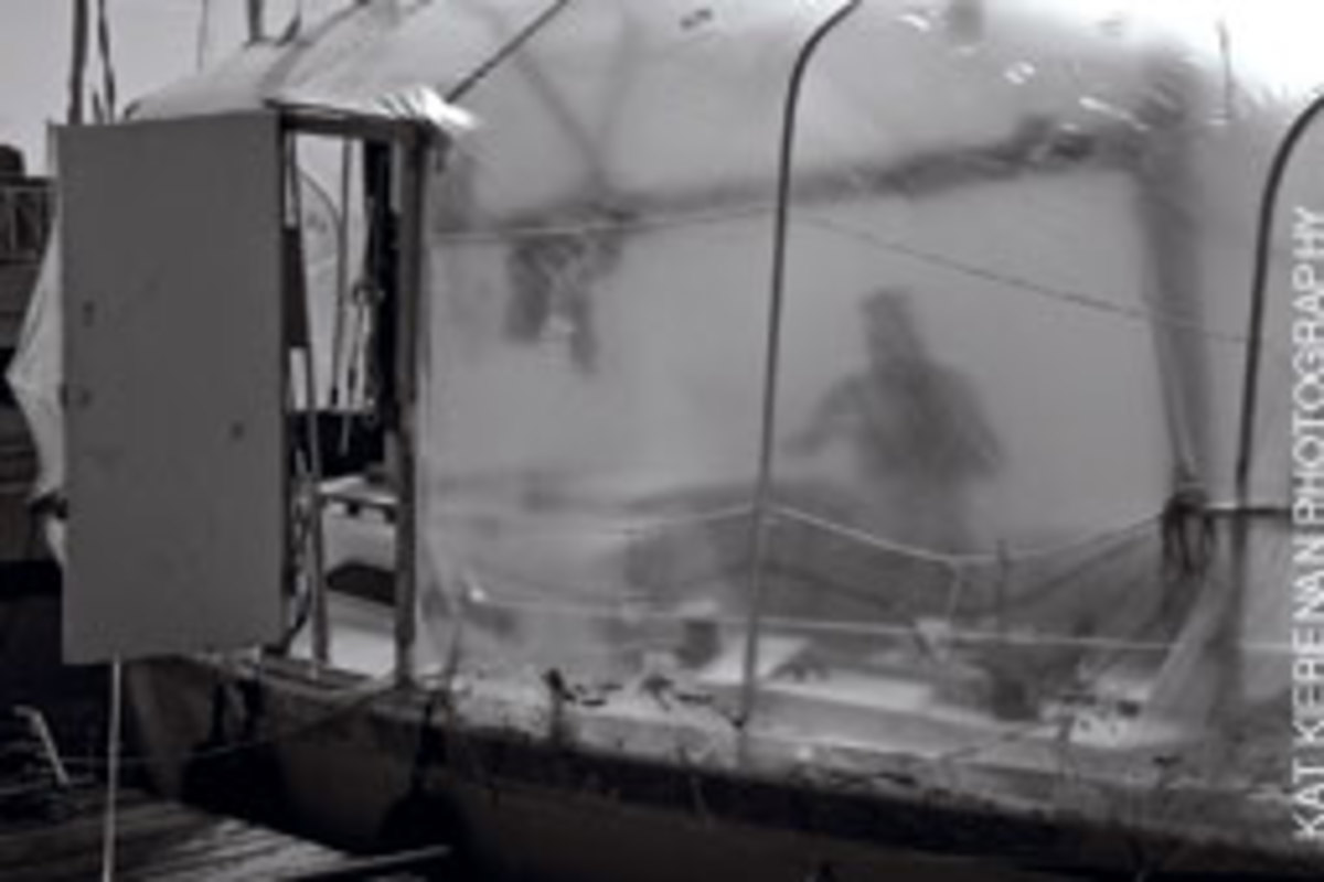Silhouettes moving behind translucent plastic wrap are the norm along the liveaboard docks.