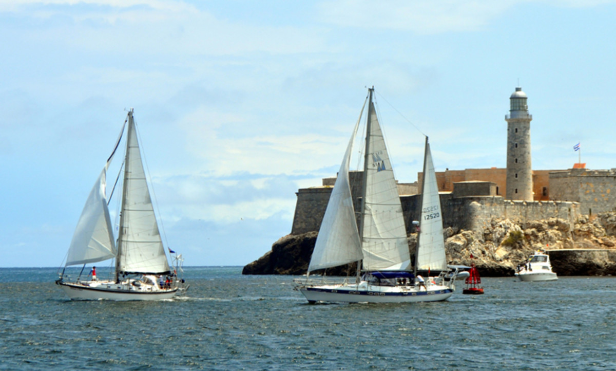 A pair of U.S.-flagged sailboats race past El Morro castle at the entrance to Havana Harbor in 2013, two years before the Obama Administration made it legal for them to enter Cuban waters.