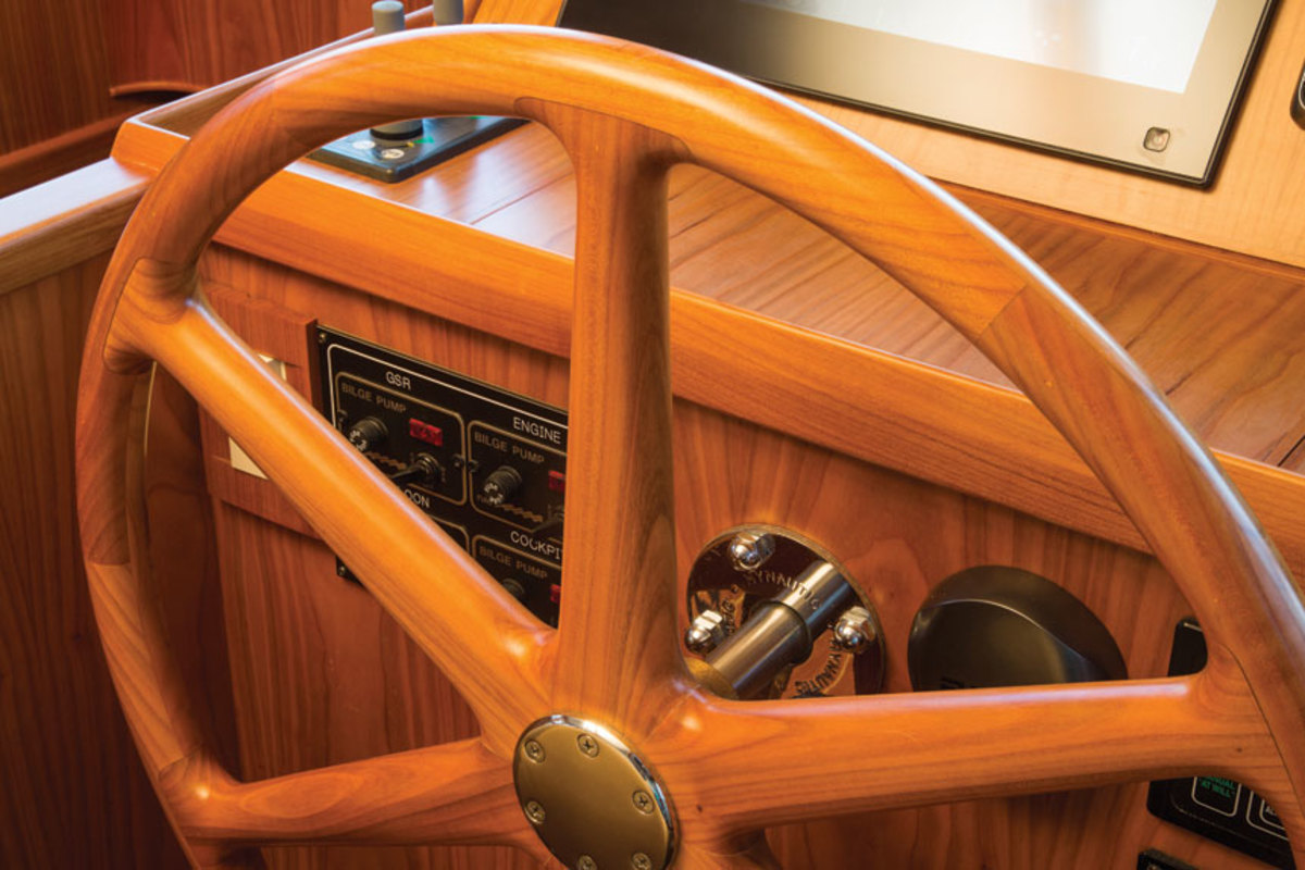 Artisanal touches, such as a solid cherry steering wheel, abound on the Krogen Express 52.