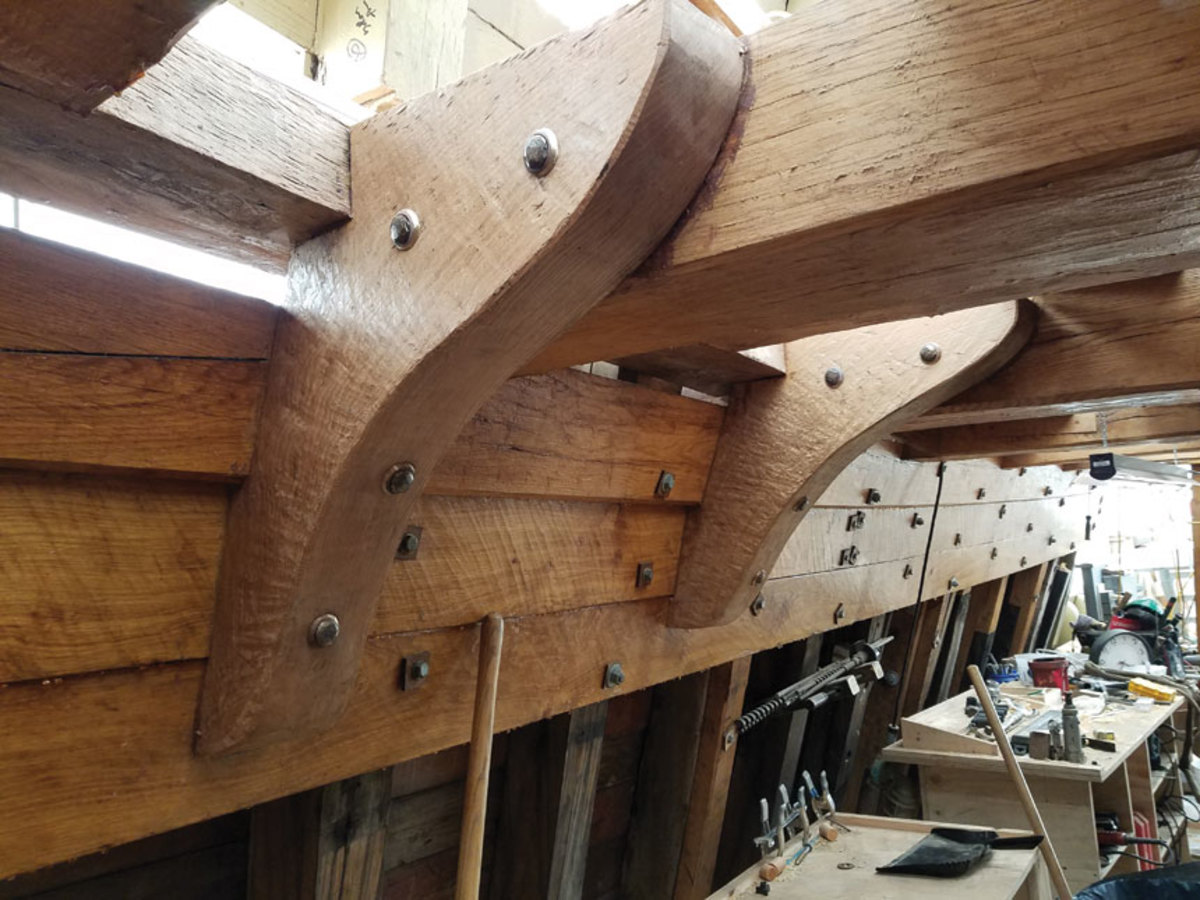 New live oak hanging knees have been installed under the half deck.
