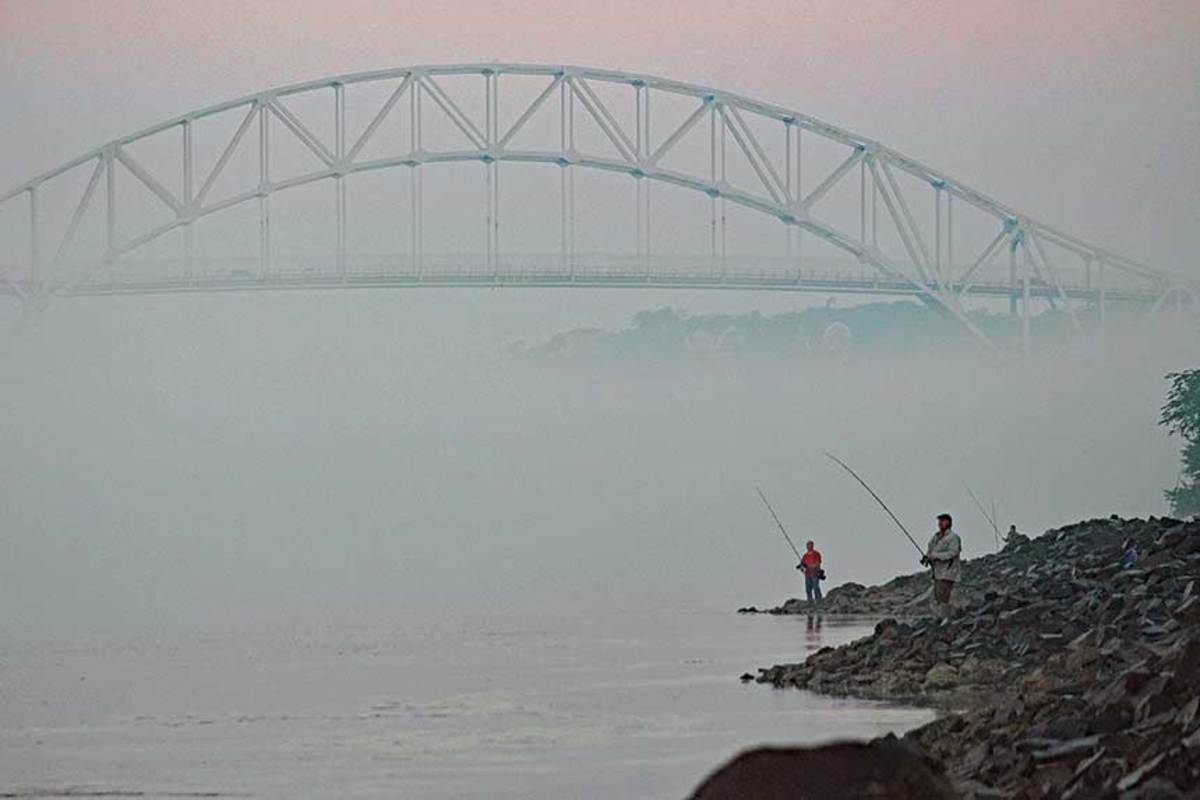These canal fishermen work the current near the Sagamore Bridge, hoping to catch the tides right and get a spectacular top-water hit from a 
big striped bass.