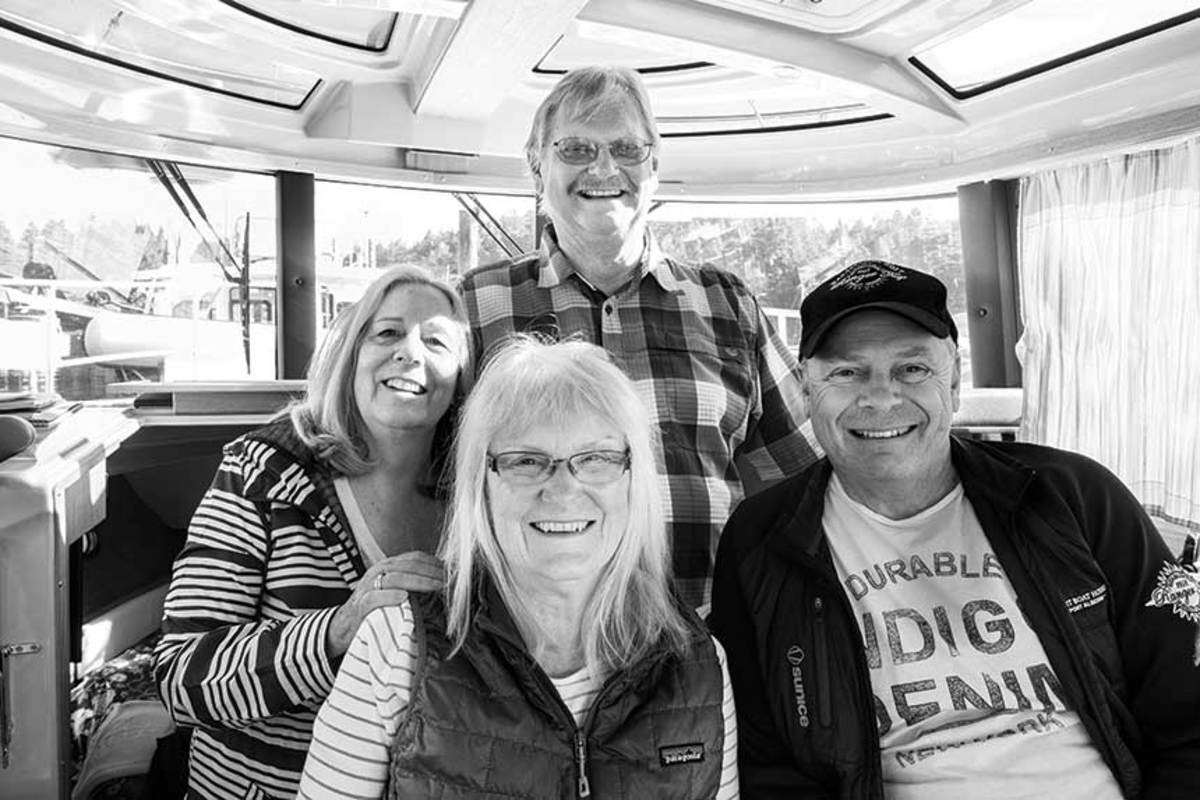 Pam and Lars Kangas, Janet Mahan and Roger Grover bring smiles and stories to a rendezvous in the Canadian Gulf Islands.