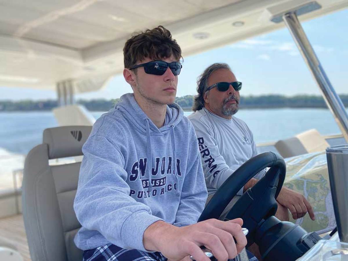 J Caruso at the wheel with his father, Tom