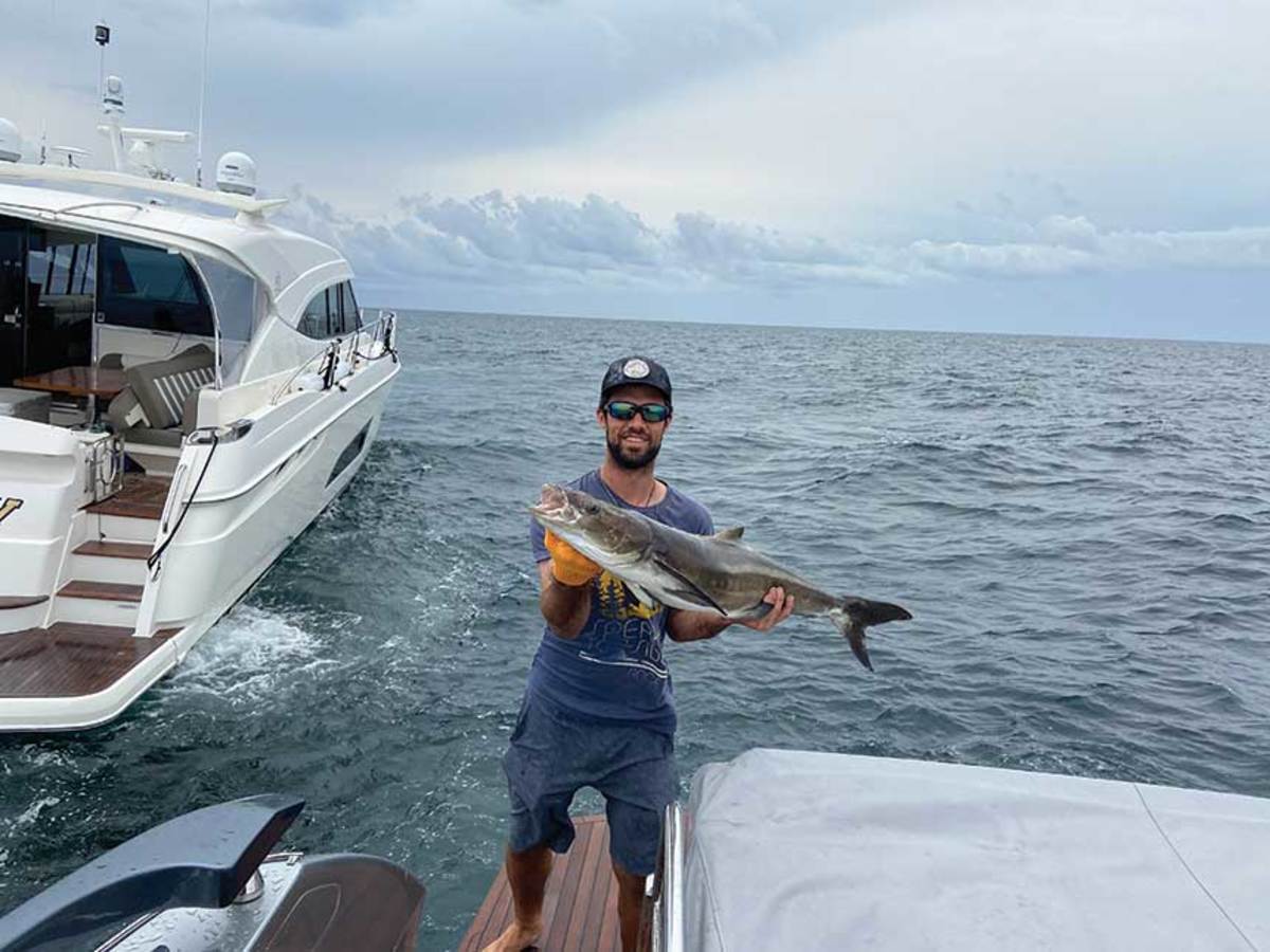 Scott Hartmann holds a cobia that provided a fresh meal when eating out wasn’t an option. 