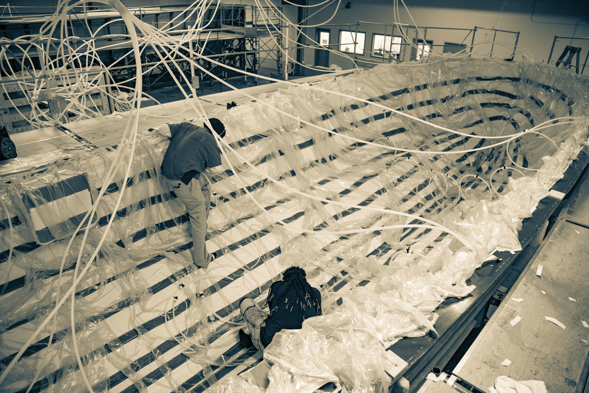 In the MJM production plant in Washington, North Carolina, workers infuse the hull of a new 3z.