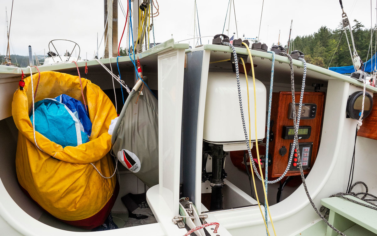 The retractable electric motor and the spinnaker bags fill the boat’s cabin.
