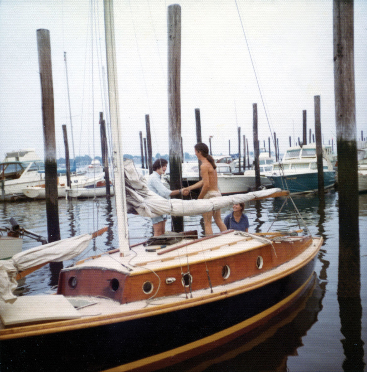 Afloat in McMichael’s Marina in Norwalk, the boat with Dan Moreland (on deck) is ready to sail in 1972.
