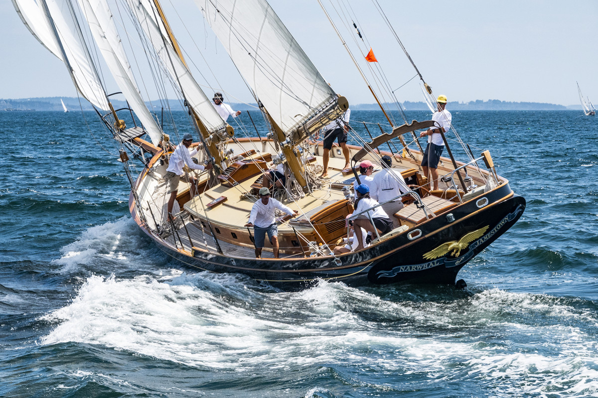The crew aboard the gaff-rigged schooner Narwhal raises the fisherman staysail as they beat upwind. The 63-footer was built in 1999 in Port Townsend, Washington, to a 1937 L. Francis Herreshoff design.